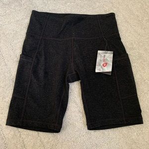 Women’s Bayleaf biker shorts with side pocket. Heather gray, Size Medium.